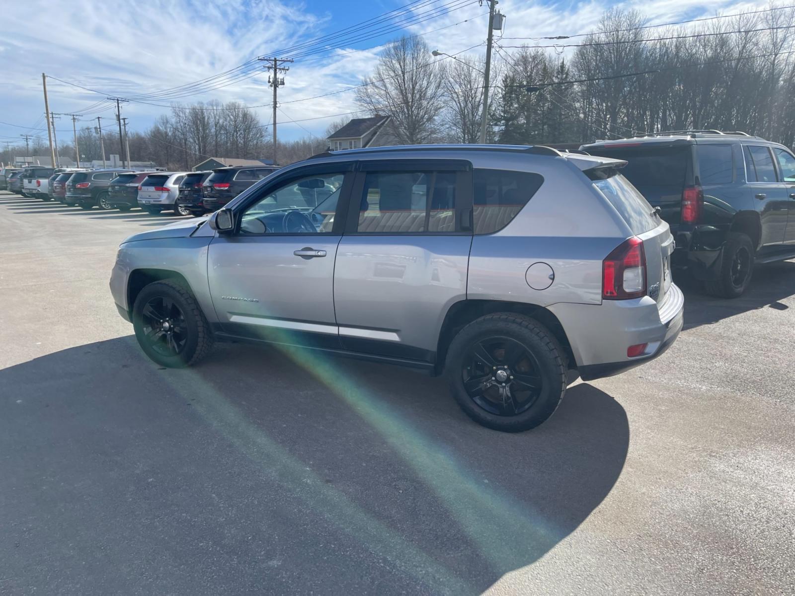 2015 Silver /Black Jeep Compass High Altitude 4WD (1C4NJDEB0FD) with an 2.4L I4 DOHC 16V engine, 6 Speed Automatic transmission, located at 547 E. Main St., Orwell, OH, 44076, (440) 437-5893, 41.535435, -80.847855 - This 2015 Jeep Compass High Altitude 4WD comes with several premium features designed for comfort, convenience, and performance. These include heated leather seats for comfort during colder days, a power sunroof that adds an airy, open feeling to the cabin, a power driver's seat to find the perfect - Photo #12